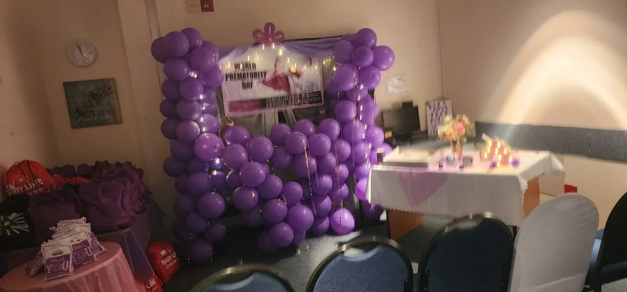 Decorated community event space supporting outreach for mothers and babies
