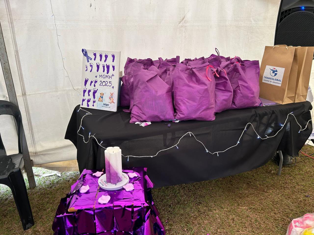 Volunteers with mothers and newborns at a Nappy Bag Initiative outreach event