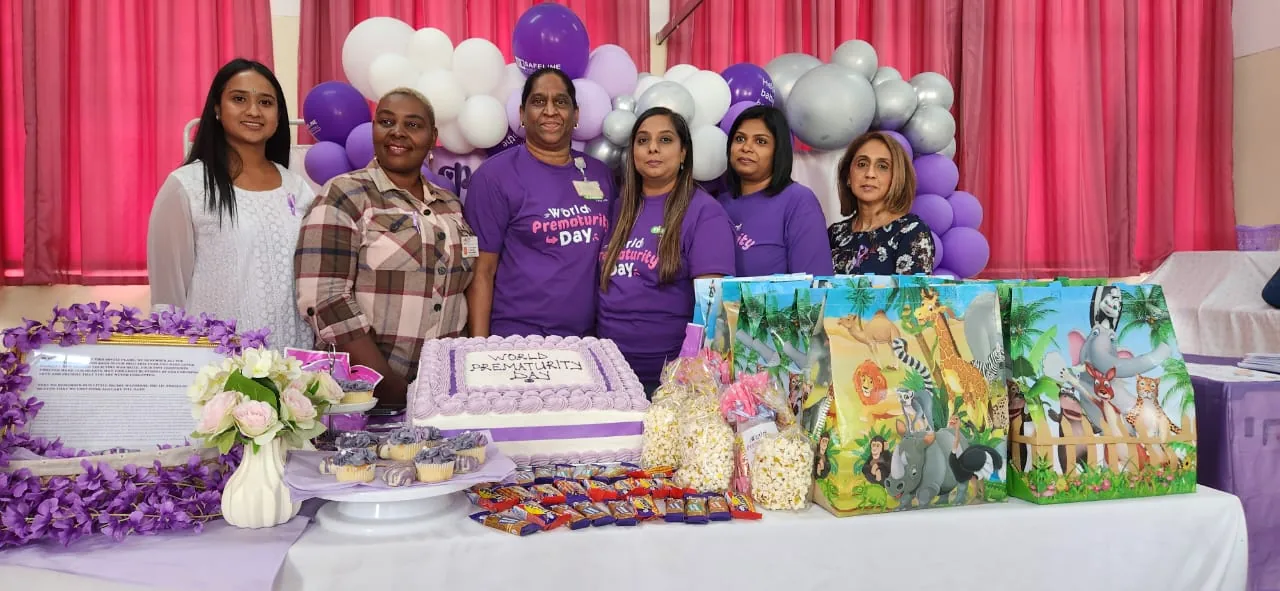 Volunteers wearing Nappy Bag Initiative branded shirts at a community event